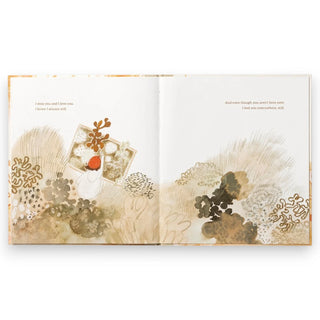 Open book with artistic illustrations and text on a white background