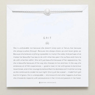 Silver chain necklace with a pearl pendant on a white card with a motivational quote with 'Grit' at the top.