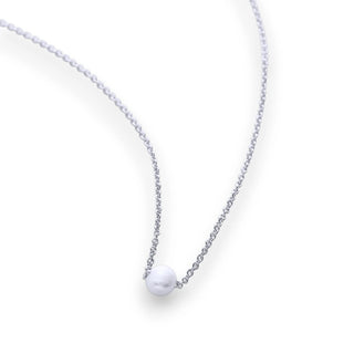 Necklace with a small white pearl pendant.