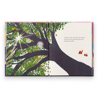Illustrated book open to a page with a tree and butterfly design on a white background