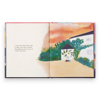 Open book with a colorful illustration of a house and trees on a white background