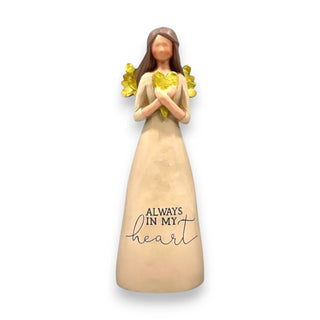 A resin angel holding a gold heart with the inscription Always In My Heart