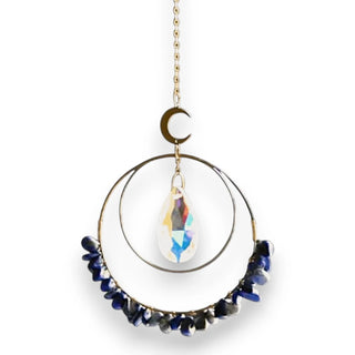 Decorative hanging suncatcher with blue stones and a crystal teardrop on a white background