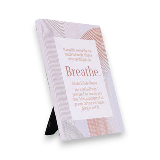 Decorative plaque with motivational quote on a white background