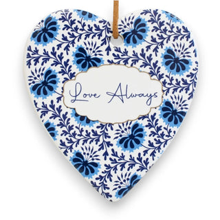 Heart-shaped ceramic ornament with blue floral pattern and 'Love Always' text on a white background