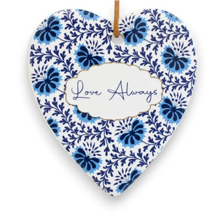 Heart-shaped ceramic ornament with blue floral pattern and 'Love Always' text on a white background