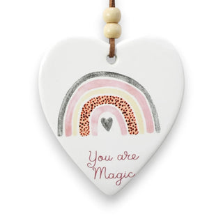 Heart-shaped ceramic ornament with rainbow and 'You are Magic' text on a white background