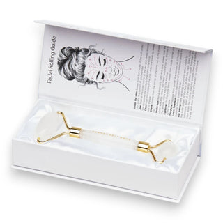 Crystal Quartz Facial roller with gold accents in a white box with instructions.