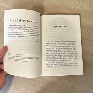 Open book with text on a wooden surface