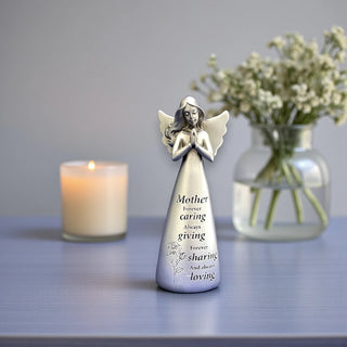 A silver resin angel statue with wings and hands in a prayer position with the inscription Mother forever caring always giving forever sharing and always loving.
