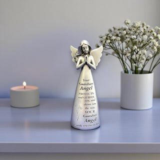 Silver resin angel statue with wings and hands in a prayer position with the inscription Your guardian angel protects and guides you, and shows you the way. Your guardian angel is with you everyday.