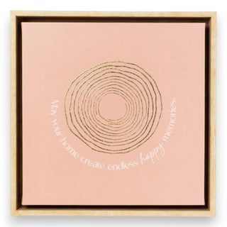 Framed artwork with concentric circle design and text on a pink background