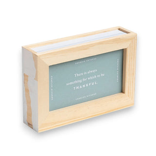 Wooden box with a green interior featuring 52 cards with uplifting quotes