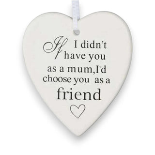 Heart-shaped ceramic plaque with text on a white background