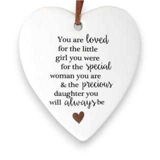 Heart-shaped ceramic plaque with a heartfelt message on a white background