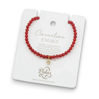 Red beaded bracelet on a Palas branded card with 'Carnelian Energy' text.