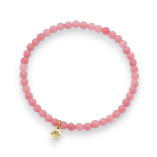 Pink jade beaded bracelet with a gold lotus charm on a white background