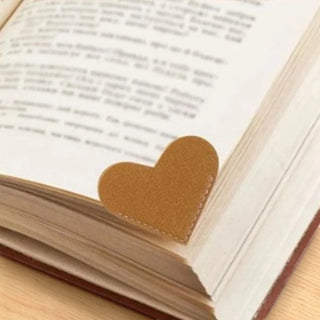 Heart-shaped bookmark on an open book