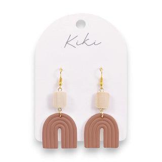 Pair of earrings with arch-shaped design on a Kiki branded card.