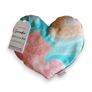 Heart-shaped heat and cool pack with a colorful design on a white background