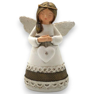 Decorative angel figurine with wings, holding a heart, on a white background