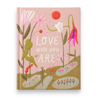 Notebook with floral design and 'Love Who You Are' text on a pink background