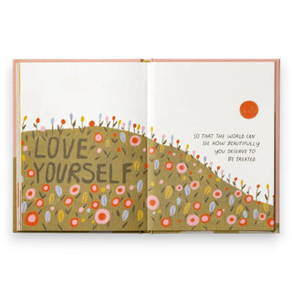 Open book with 'Love Yourself' illustration and motivational quote on a white background