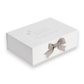White gift box with a gray ribbon on a white background