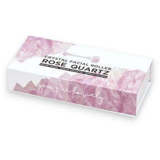 Rose quartz crystal facial roller packaging with 'you are lovely' text on a white background