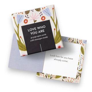 Set of pop-open cards with floral design and motivational message on a white background