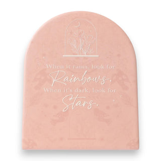 Pink plaque with motivational quote and floral design on a white background